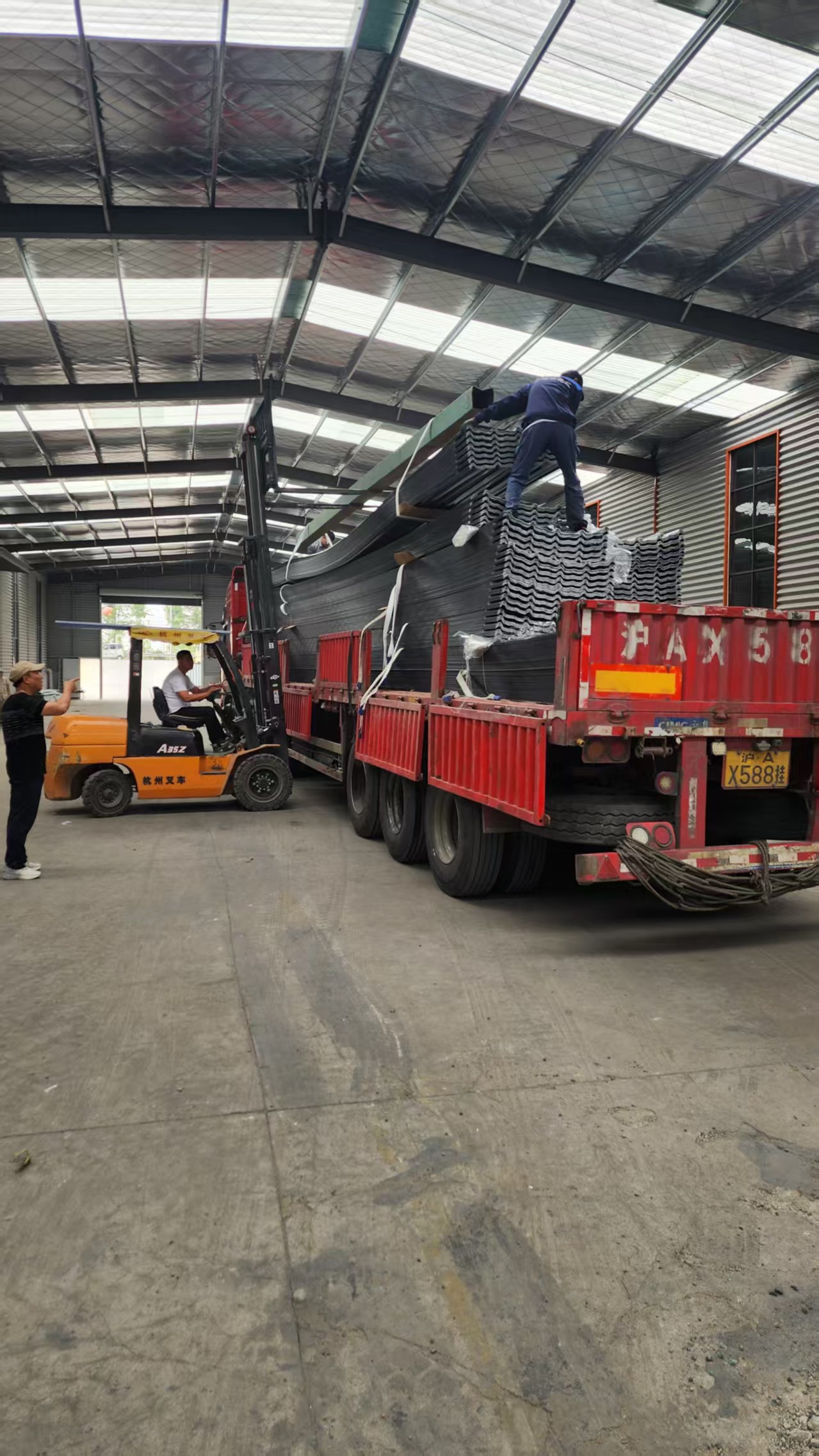 Forklift loading FRP sheets with careful handling