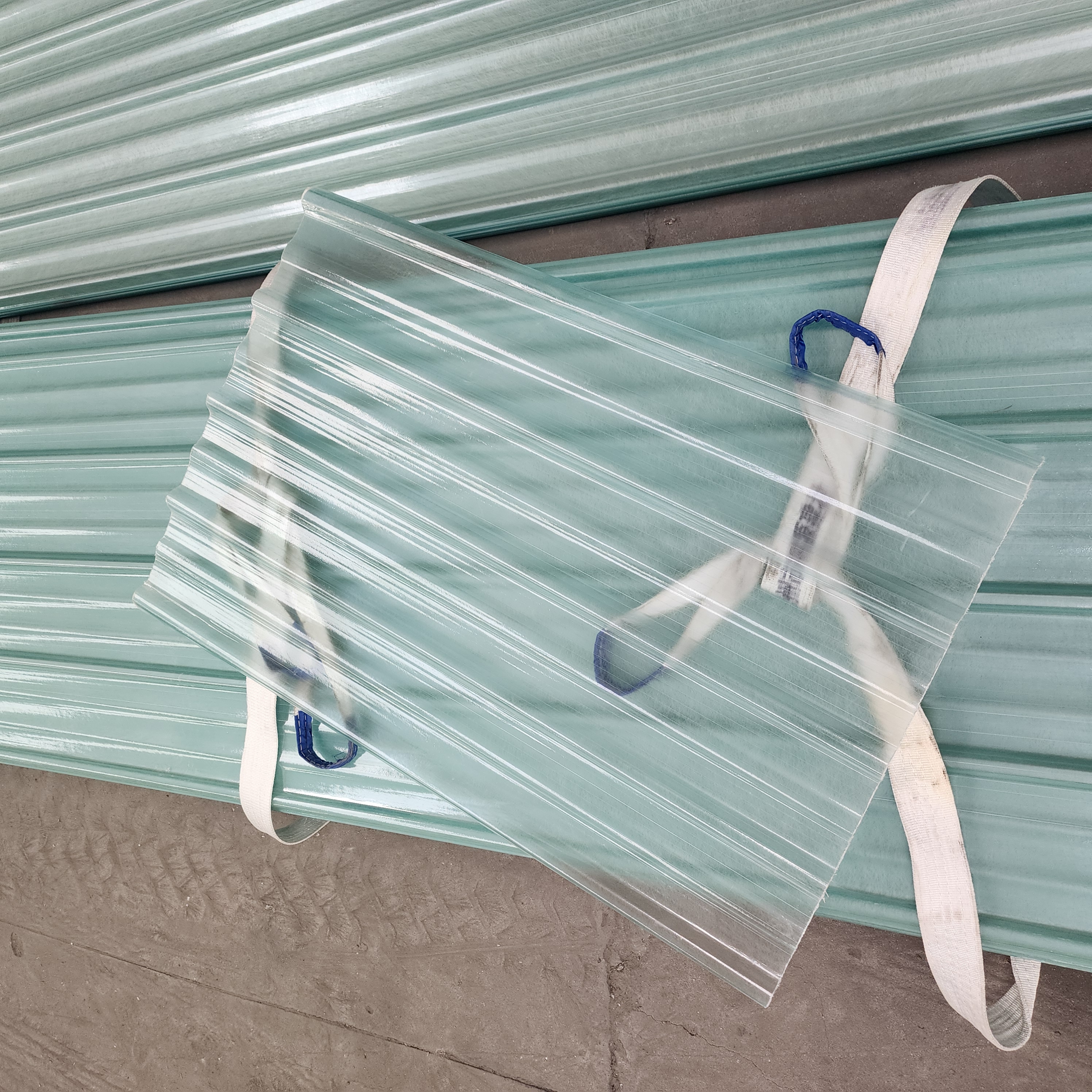 Transparent FRP sheet on light green FRP sheets showing natural light transmission